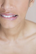 A woman biting her lip, looking worried