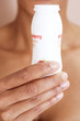 A woman drinking a probiotic yoghurt drink