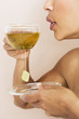 A woman drinking a cup of herbal tea
