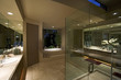 Spotlights illuminate a spacious and elegant bathroom
