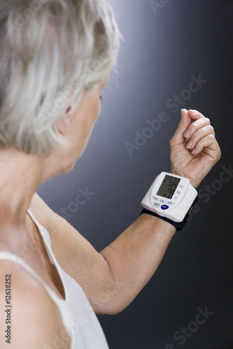 Photo: A senior woman with a heart rate monitor on her wrist A senior woman with a heart rate monitor on her wrist