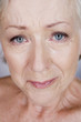 A senior woman crying