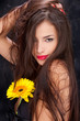 Pretty woman with long hair and yellow daisy Pretty woman with long hair and yellow daisy