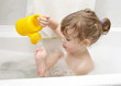 Child is playing in a bath