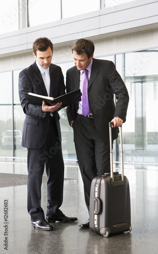 Photo: Two businessmen discussing papers Two businessmen discussing papers