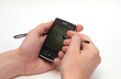 Manle hands with pocket PC isolated