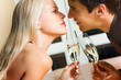 Couple kissing on romantic date or celebrating together Couple kissing on romantic date or celebrating together