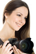 Portrait of a beautiful young woman with camera