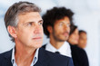Closeup of an handsome businessman with his colleagues