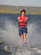 Handsome man waterskiing