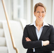 Photo: Portrait of mature business woman with hands folded Portrait of mature business woman with hands folded