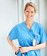 Photo: Beautiful elegant successful doctor in blue uniform Beautiful elegant successful doctor in blue uniform