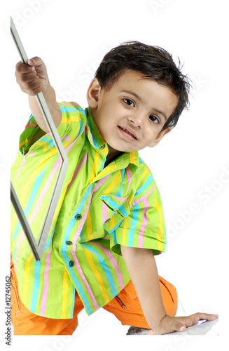 Photo: boy showing object boy showing object