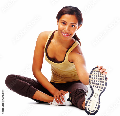 Happy fit woman doing stretching exercise, isolated