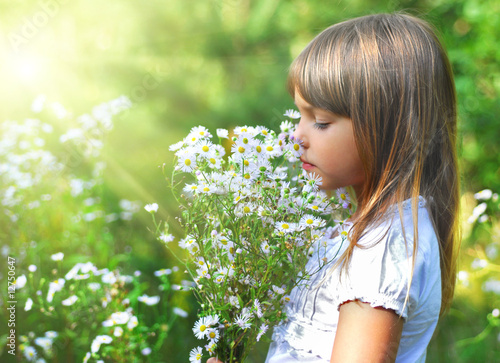 Photo: Little girl with the wild flowers Little girl with the wild flowers
