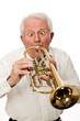 Funny white haired Senior playing the trumpet