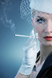 Beautiful smoking woman. Retro portrait