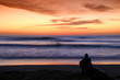 man alone watching sunset man alone watching sunset