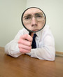 Man with a magnifier in a hand Man with a magnifier in a hand