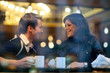 Foto: Happy young couple in cafe, having a great time together Happy young couple in cafe, having a great time together