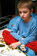 Boy is reading book.