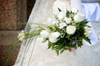 An image of a bride holding her bouquet of roses
