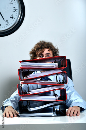 Photo: Businessman and folders Businessman and folders