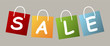 Set of price tags spelling out SALE on grey background