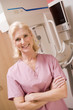 Portrait Of A Nurse In Front Of A Mammogram Machine