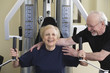 Senior couple exercising in the gym.