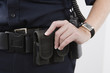 Close up of pouches on a cop's waist belt.