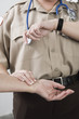 Emergency Medical Service officer checking pulse