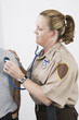Foto: Emergency Medical Service officer checking pulse Emergency Medical Service officer checking pulse