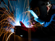 Welder shielding sparks from metal Welder shielding sparks from metal