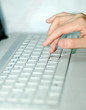 Photo: Woman operating computers Woman operating computers