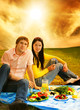 Photo: Young couple at romantic picnic Young couple at romantic picnic