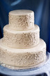 Elegant ivory wedding cake with a piped embroidered lace design Elegant ivory wedding cake with a piped embroidered lace design