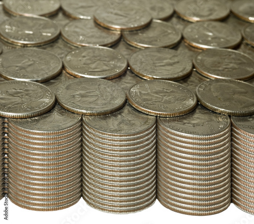 Photo: Stacks of quarters with golden tones Stacks of quarters with golden tones
