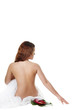 beautiful girl with flowers sits a back