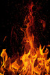 flame and sparks isolated over black background