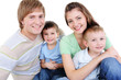 happy young family with two little sons