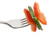 Slices of sweet pepper and cucumber on a fork