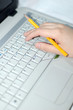 Photo: Woman handing a pencil operating computers Woman handing a pencil operating computers