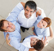 Successful business people forming a huddle