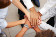 Closeup of hands together showing signs of unity