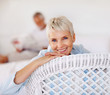 A relaxed aged woman sitting on a chair