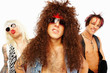 Confident rockers standing together over white background