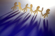 Paper-chain people holding hands