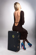 Photo: beauty woman sit on old case beauty woman sit on old case