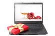 red gift box lies on the laptop keyboard